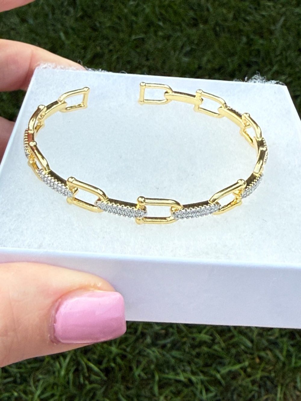 Bangle bracelet with horse bit and pave links